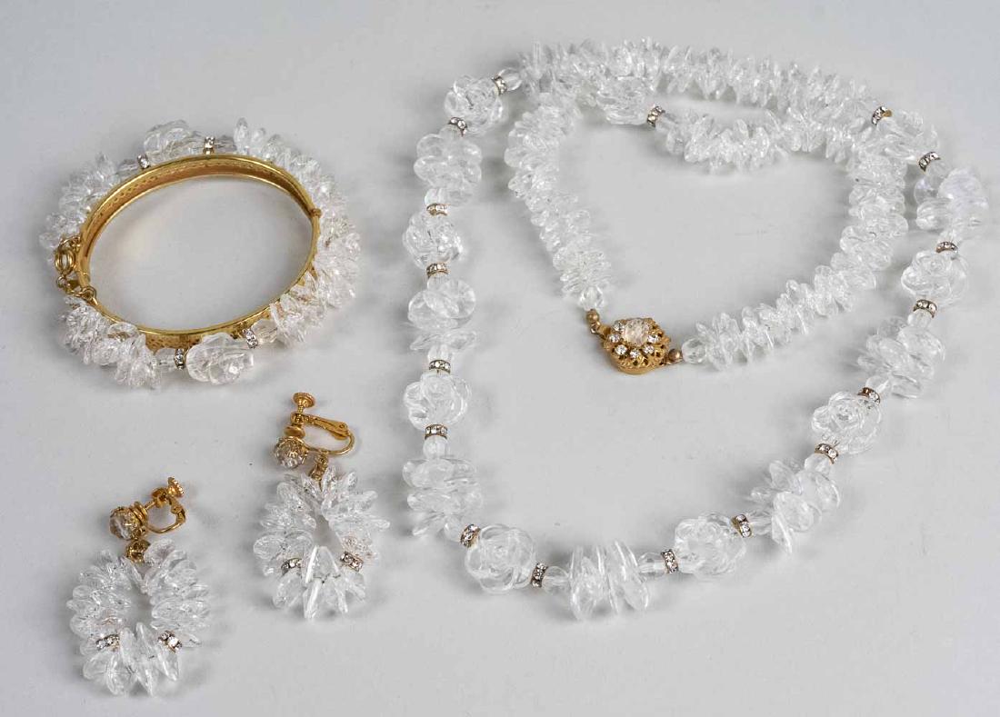 Miriam Haskell Jewelry Suite: Single strand of simulated rock crystal beads and rondells, with matching earrings and bangle. Necklace, length 28 inches. Notice to bidders: Condition reports and additional photographs are provided