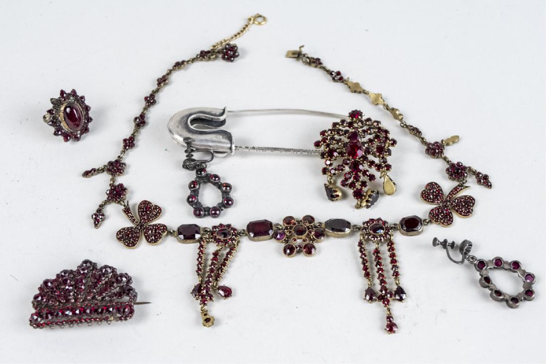 Group of Vintage Garnet Jewelry: Including a Czechoslovackian garnet necklace, two brooches, earrings, ring and a safety pin brooch. Necklace, length 16 inches. Notice to bidders: Condition reports and additional photographs are prov