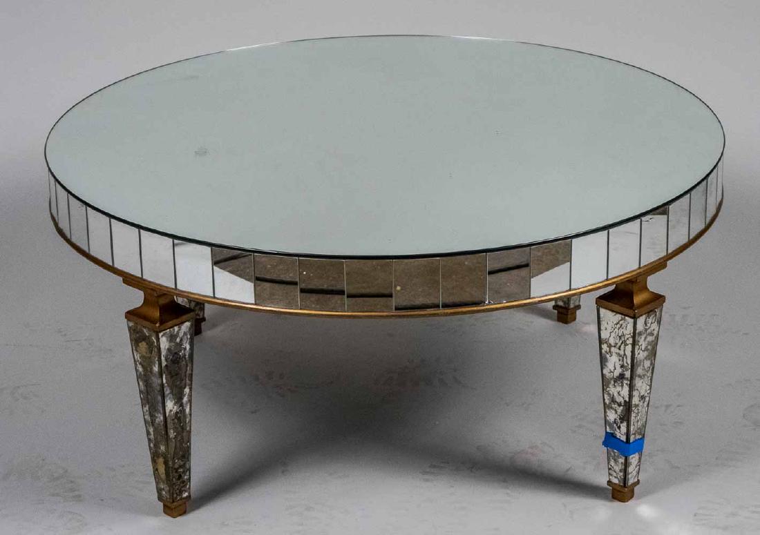 Mirrored Circular Coffee Table: Circular top on tapered square legs. Height 16 inches, diameter 36 inches. Notice to bidders: Condition reports and additional photographs are provided by request as a courtesy to our clients, as such
