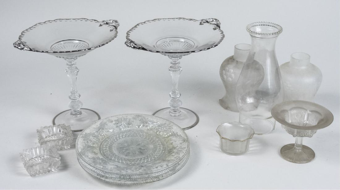 Group of Colorless Glass Articles: Including a pair of compotes, pair of salt cellars, pair of etched glass shades, glass chimney, etc. Pair of compotes, height 7 1/2 inches. Notice to bidders: Condition reports and additional photogra
