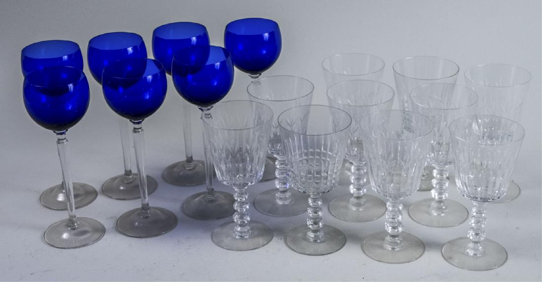 Two Partial Sets of Stemware: Set of seven cobalt blue hock glasses with colourless stems and a set of ten colourless glass wine glasses. Notice to bidders: Condition reports and additional photographs are provided by request as a