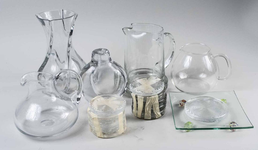 Group of Colorless Glass Table Articles: Including two vases (one Baccarat), two pitchers, a tea kettle, etc. Various sizes. Notice to bidders: Condition reports and additional photographs are provided by request as a courtesy to our clients