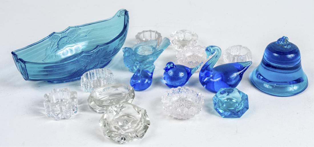 Group of Glass Table Decorations: Approximately sixteen pieces, including salt cellars, etc. Various sizes. Notice to bidders: Condition reports and additional photographs are provided by request as a courtesy to our clients, as such 