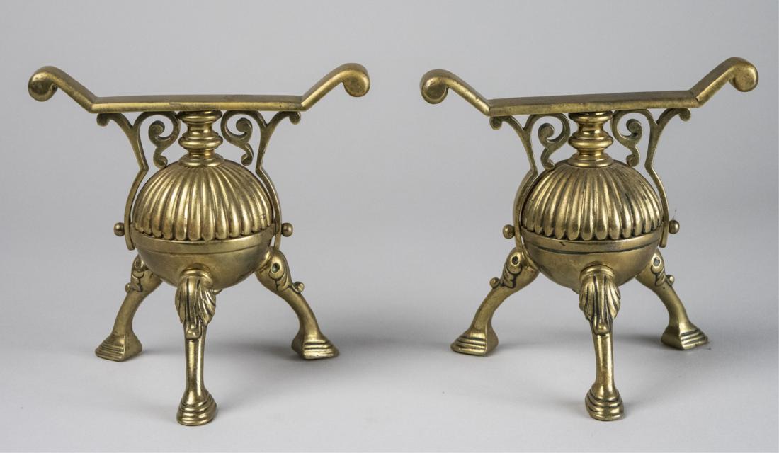 Pair of Andirons: Brass globes on three legs with hoofed feet. Height 7 inches. Notice to bidders: Due to the nature of this particular online sale, the lots offered may not be available for detailed condition reports 