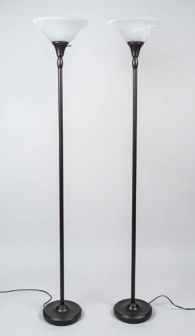 Pair of Torchieres: Frosted glass shades. Height 6 feet. Notice to bidders: Due to the nature of this particular online sale, the lots offered may not be available for detailed condition reports or additional photography