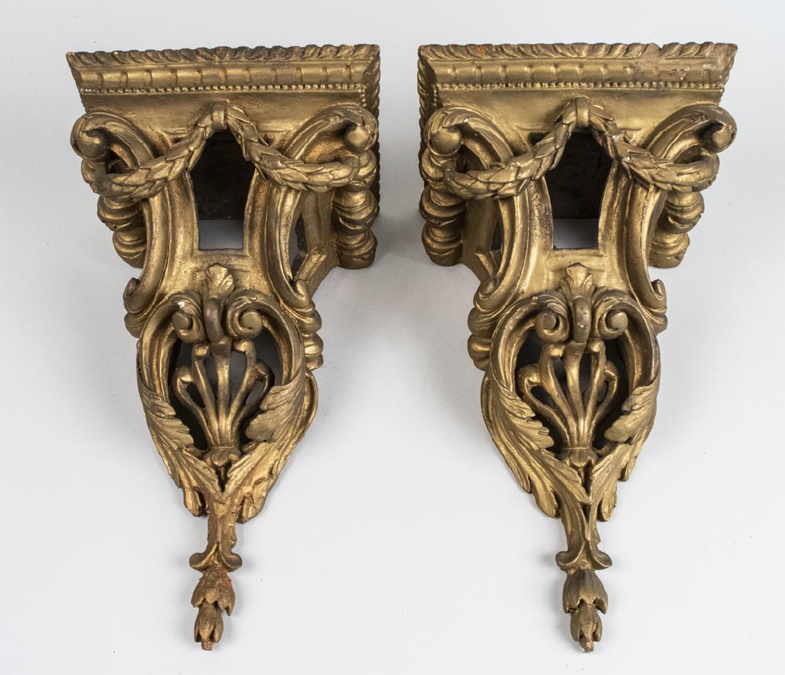 Pair of Painted Metal Wall Brackets: Neoclassical style with swag decoration. Height 16 inches. Notice to bidders: Due to the nature of this particular online sale, the lots offered may not be available for detailed condition reports or 
