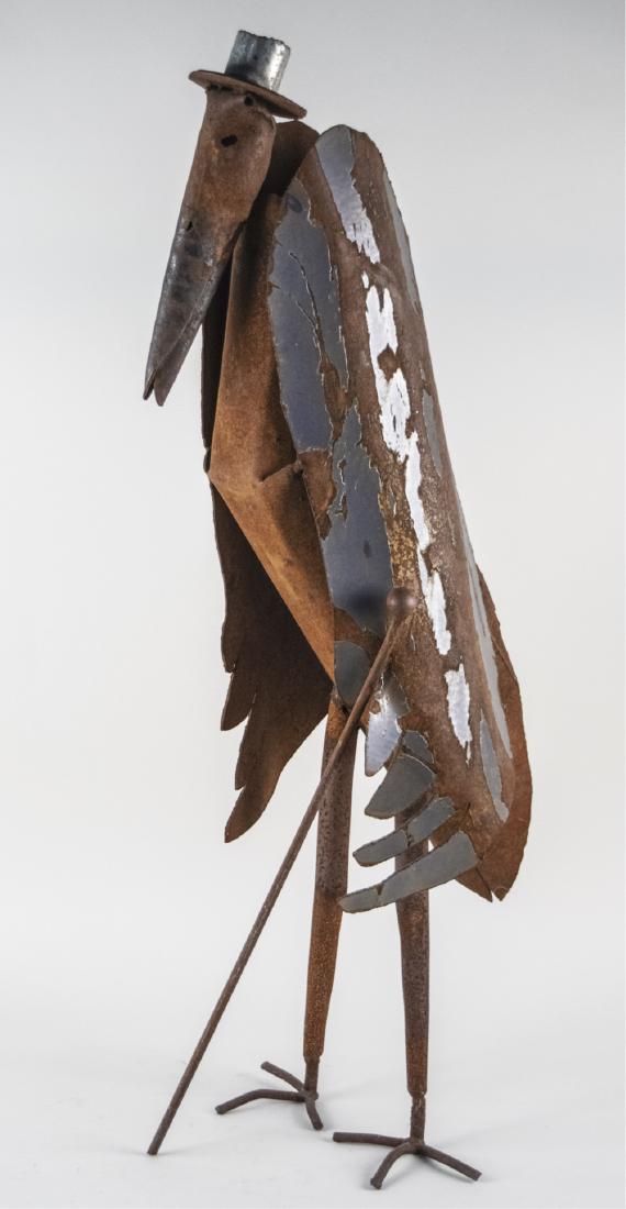 Metal Sculpture: Found metal modeled as a pelican in top hat with cane. Overall height, 42 inches. Notice to bidders: Condition reports and additional photographs are provided by request as a courtesy to our clients, 