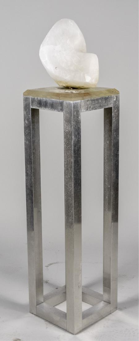 Alabaster Sculpture: Abstact form on an open aluminum pedestal with lucite top. Height with stand 55 inches. Notice to bidders: Condition reports and additional photographs are provided by request as a courtesy to our cli