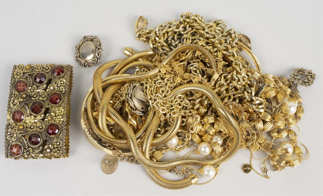 Group of Gold Tone Jewelry: Including chain necklaces, bangles, pins, bracelet, etc. Notice to bidders: Condition reports and additional photographs are provided by request as a courtesy to our clients, as such any condition rep