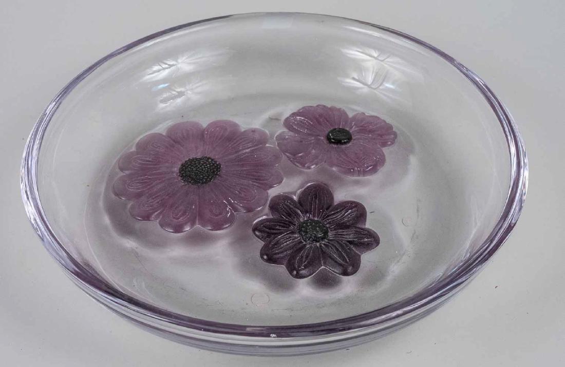 Daum Glass Center Bowl: Circular, clear glass shallow bowl with pate de verre flowers in the center. Diameter 13 inches. Notice to bidders: Condition reports and additional photographs are provided by request as a courtesy t