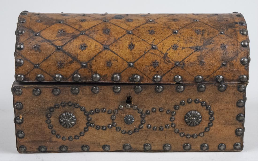 Victorian Casket: Quilted hump back top box with nail head decoration. Height 6 inches, width 10 3/4 inches, depth 5 inches. Notice to bidders: Condition reports and additional photographs are provided by request as a