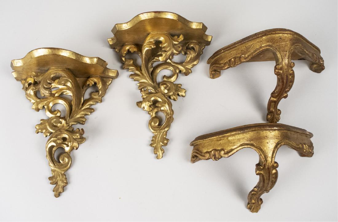 Two Pairs of Gilt Wood Brackets: Both with scroll decoration. Larger pair, height 9 inches. Notice to bidders: Condition reports and additional photographs are provided by request as a courtesy to our clients, as such any condition r