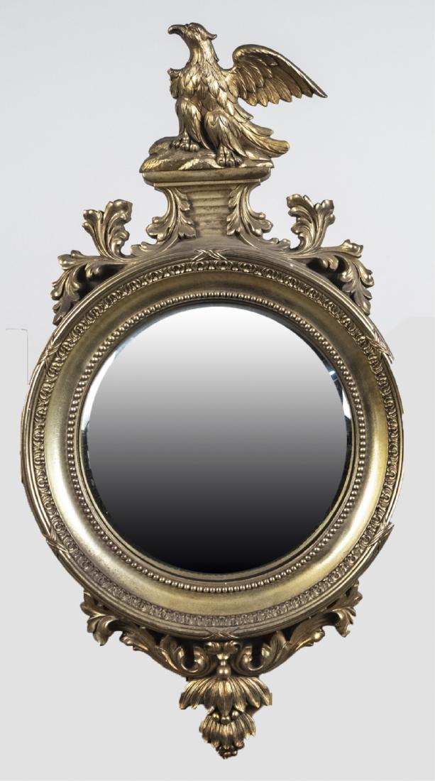 Gilt Wood Convex Mirror: Circular convex mirror plate, surmounted by a spread winged eagle. 34 1/2 x 18 1/4 inches. Notice to bidders: Condition reports and additional photographs are provided by request as a courtesy to our 