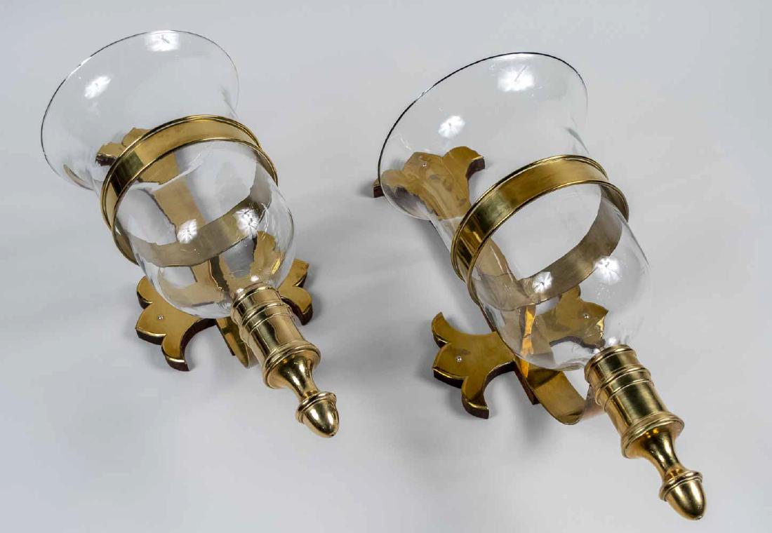 Pair of Brass and Glass Wall Vases: Gothic revival style backplate. Height 30 inches. Notice to bidders: Due to the nature of this particular online sale, the lots offered may not be available for detailed condition reports or additiona