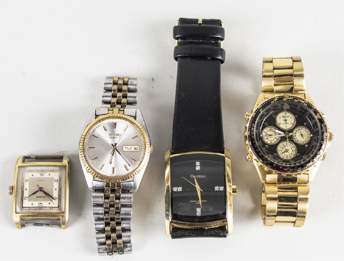 Four Vintage Wristwatches: Compriising two Seiko quartz watches, an Amitron dress watch with black leather band and an Otona watch without a band. Notice to bidders: Condition reports and additional photographs are provided by
