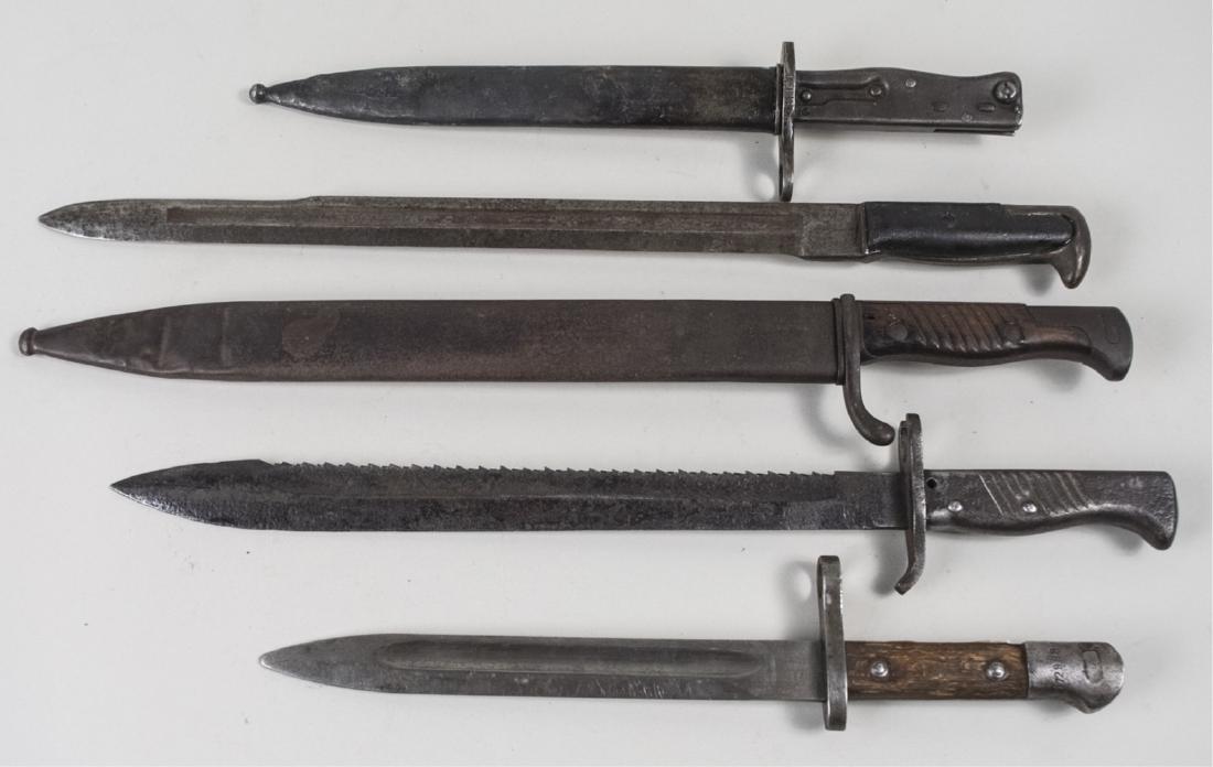Group of Five WWI and WWII Era Bayonets: Including a German Mauser Model 95, a German 1895/1905 Butcher bayonet, a German 1898/1905 Sawback bayonet with metal grip, and two others. Largest blade 16 inches. Notice to bidders: Condition report