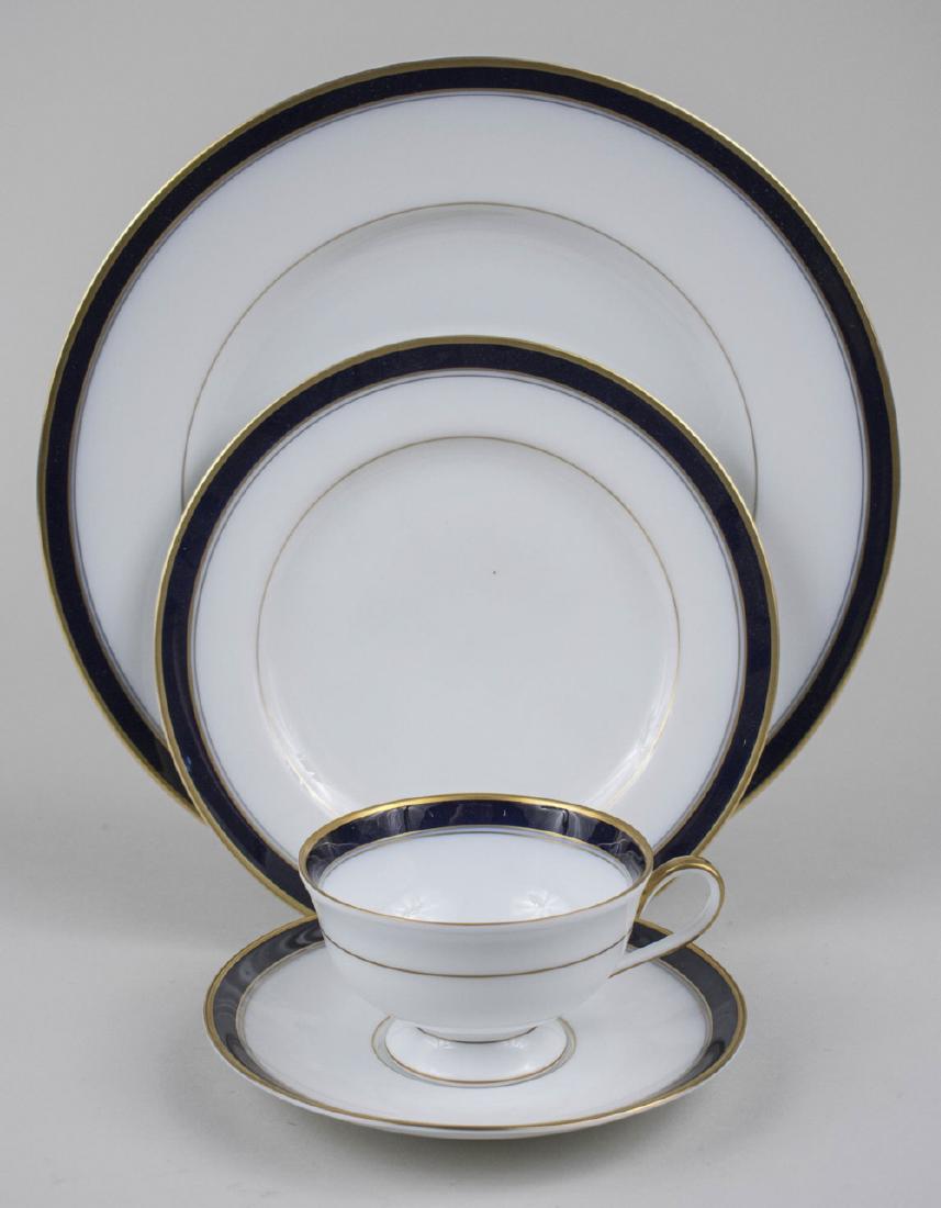 Franconia - Krautheim Porcelain Dinner Service: Approximately fifty pieces, Royal Cobalt pattern, comprising eight dinner plates, seven salad plates, seven bread plates, eight soup plates, eight cups, nine saucers, two rectangular platters, and a r