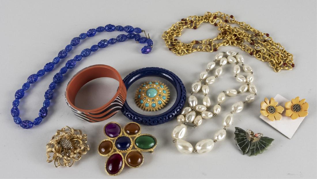 Group of Costume Jewelry: Including a neck chain signed Deanna Hamro, three simulated gemstone pins, plastic bangle, carved hardstone butterfly pin, simulated pearl necklace, flower ear clips and a blue glass bead necklace, et