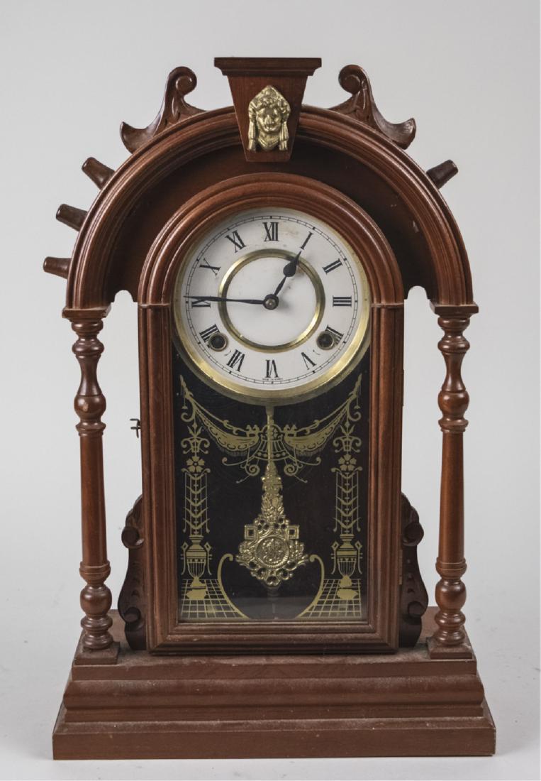 American Style Shelf Clock: Dial signed, Made in Korea. Height 21 inches. Notice to bidders: Due to the nature of this particular online sale, the lots offered may not be available for detailed condition reports or additional ph