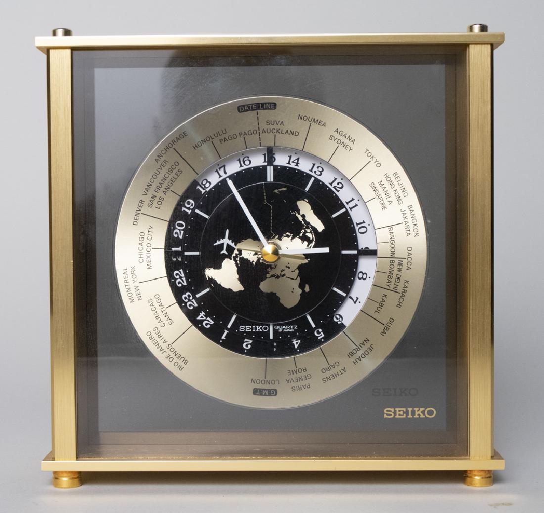 Seiko World Clock: Brass desk clock with world time zones. Height 8 3/4 inches. Notice to bidders: Due to the nature of this particular online sale, the lots offered may not be available for detailed condition reports o