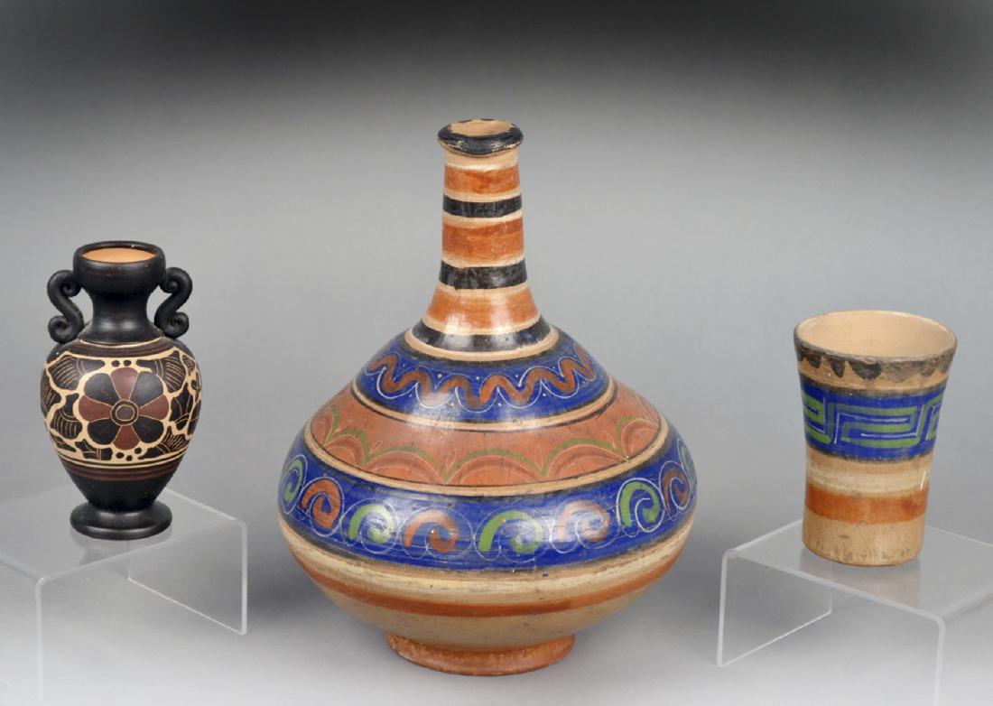 Three Ceramic Decorations: Comprising a mezzo American polychrome painted pottery vase and beaker and another two handle pottery vase. Tallest 11 1/4 inches. Notice to bidders: Due to the nature of this particular online sale, 
