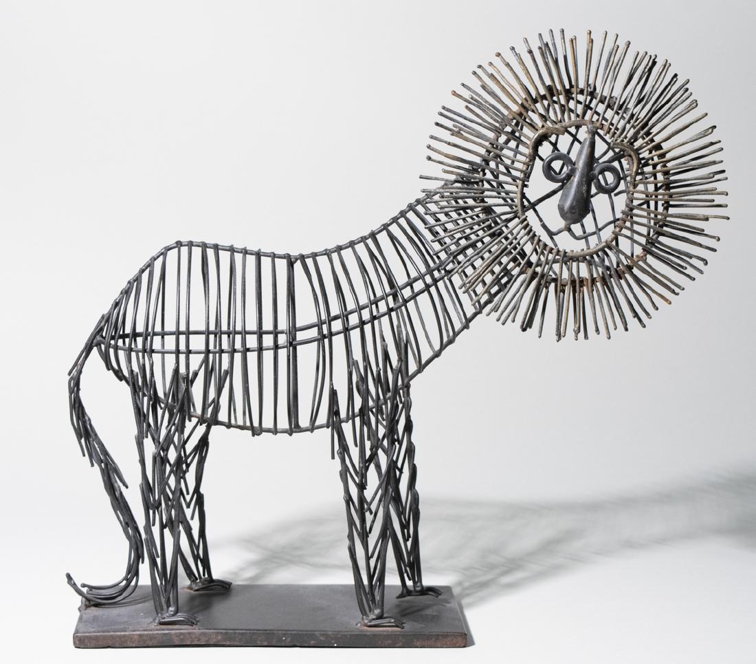 Wire Lion: In the style of Curtis Jere. Standing, facing to his right. Height 16 inches. Notice to bidders: Due to the nature of this particular online sale, the lots offered may not be available for detailed co