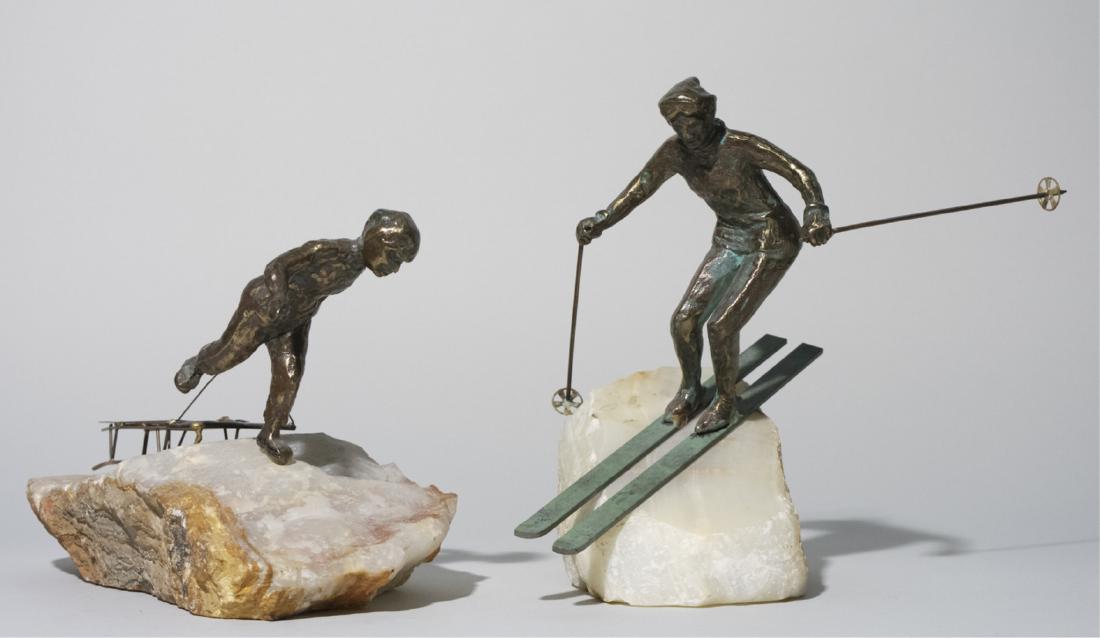 Two Curtis Jere Sculptures on Onyx: One modeled as a skiier and the other a sledder mounted on onyx. Jere sticker on base of the skiier. Notice to bidders: Due to the nature of this particular online sale, the lots offered may not be av