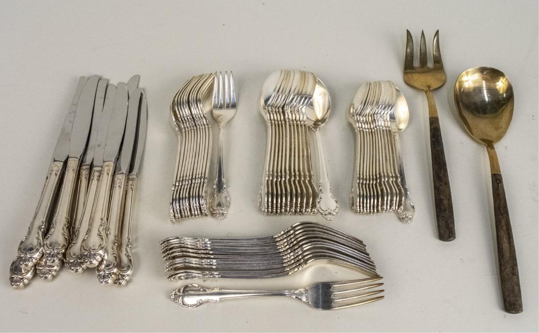 Holmes & Edwards Flatware Set: Comprising twelve dinner knives, twelve dinner forks, twelve salad forks, twelve soup spoons, twelve teapsoons, together with a set of six porcelain handled cheese knives.. Notice to bidders: Conditio