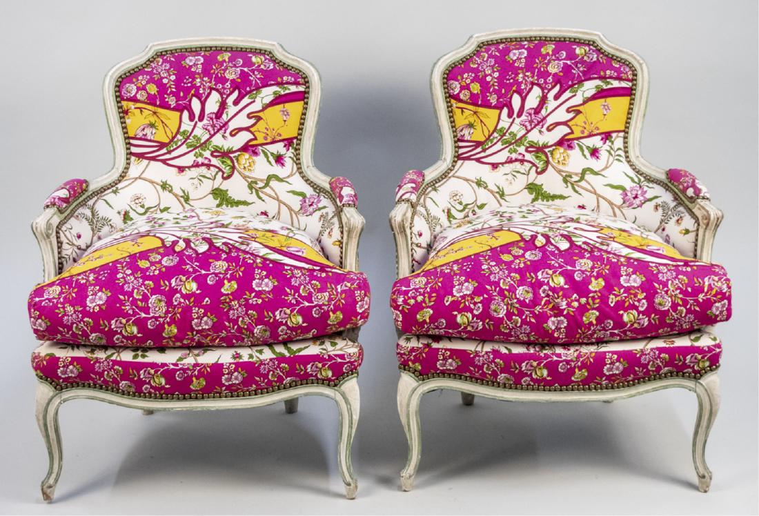 Pair of Louis XV Painted Bergeres: Cream painted chairs with floral vine print upholstery. Notice to bidders: Condition reports and additional photographs are provided by request as a courtesy to our clients, as such any condition repo