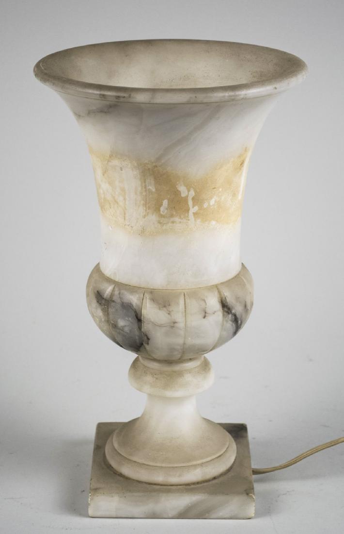 Art Deco Alabaster Lamp: Campagna form, electrified. Height 11 3/4 inches. Notice to bidders: Due to the nature of this particular online sale, the lots offered may not be available for detailed condition reports or additiona