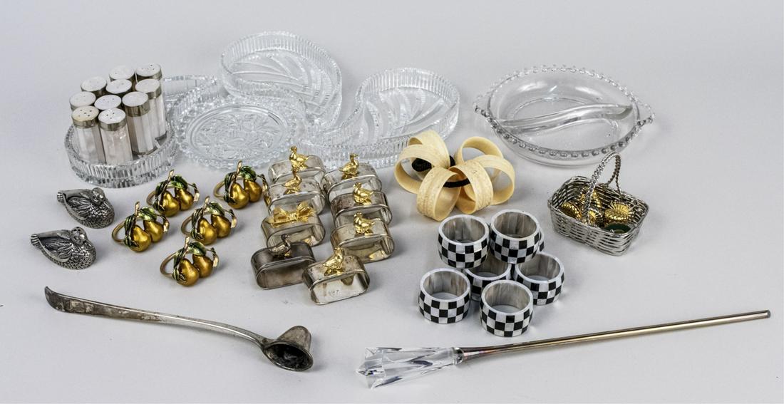 Miscellaneous Group of Table Decorations: Including a set of mother of pearl shakers, candle snuffer, set of place card holders, napkin rings, etc. Notice to bidders: Condition reports and additional photographs are provided by request as a c