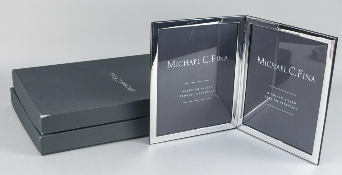 Pair of Michael C Fina Silver Picture Frames: Manhattan pattern double 8 x 10 frames. Notice to bidders: Due to the nature of this particular online sale, the lots offered may not be available for detailed condition reports or additional photogra