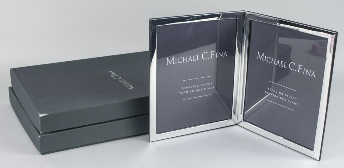 Pair of Michael C Fina Silver Picture Frames: Manhattan pattern double 8 x 10 frames. Notice to bidders: Due to the nature of this particular online sale, the lots offered may not be available for detailed condition reports or additional photogra