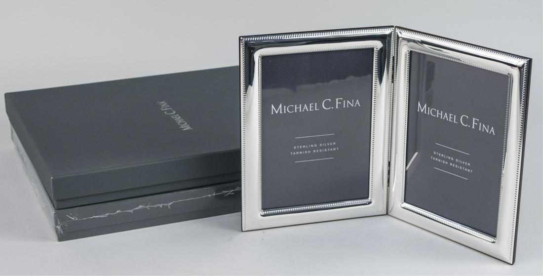Pair of Michael C Fina Silver Picture Frames: Lexington pattern double 5 x 7 frames. Notice to bidders: Due to the nature of this particular online sale, the lots offered may not be available for detailed condition reports or additional photograp