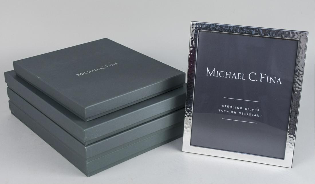 Group of Four Michael C Fina Silver Picture Frames: 8 x 10 frames in the Soho, Tribeca, Manhattan, and Greenwich patterns. Notice to bidders: Due to the nature of this particular online sale, the lots offered may not be available for detailed condition
