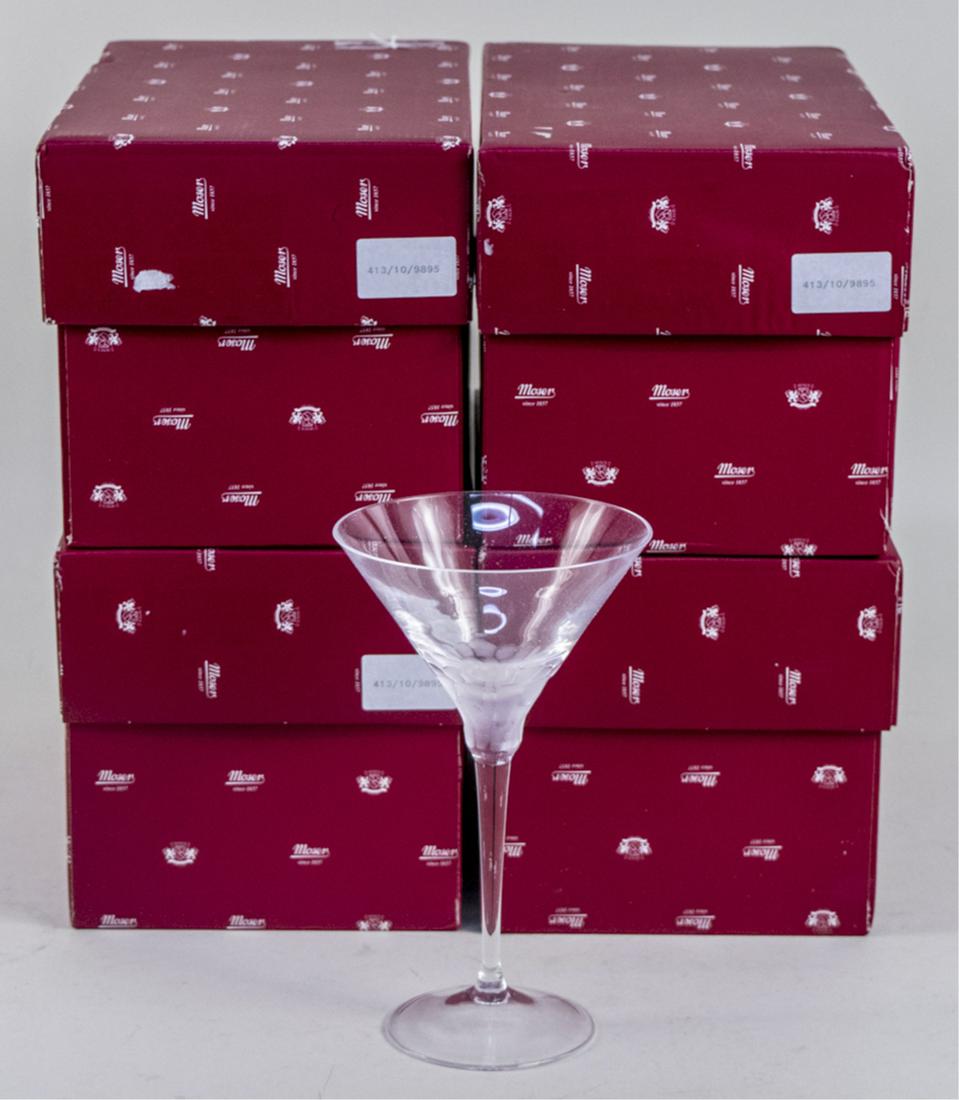 Set of Four Moser Pebble Clear Martini Glasses: In original boxes. Notice to bidders: Due to the nature of this particular online sale, the lots offered may not be available for detailed condition reports or additional photography. The absence of a