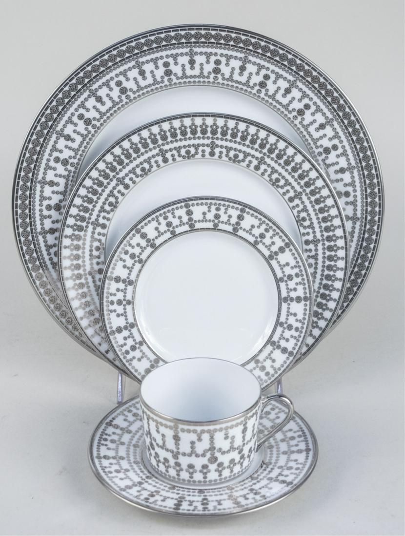 Haviland Tiara Platinum Porcelain Dinner Service: Sixty six pieces, comprising twelve five piece place settings (cup, saucer, bread plate, salad plate and dinner plate), five chargers, and an oval vegetable bowl. Vegetable bowl and chargers in origin