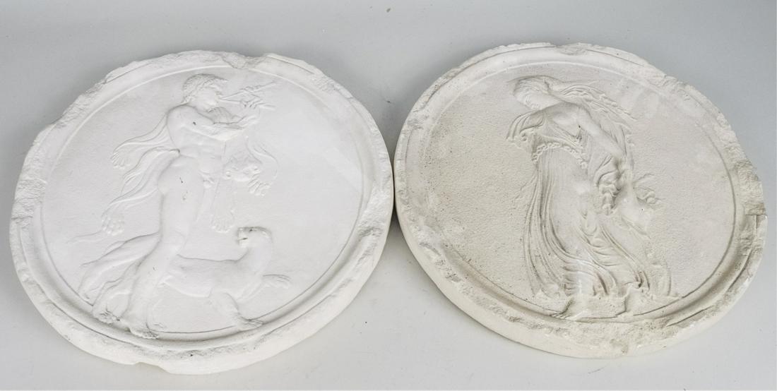 Pair of Plaster Wall Plaques: Circular plaques with Classical decoration. Diameter 17 inches. Notice to bidders: Due to the nature of this particular online sale, the lots offered may not be available for detailed condition report
