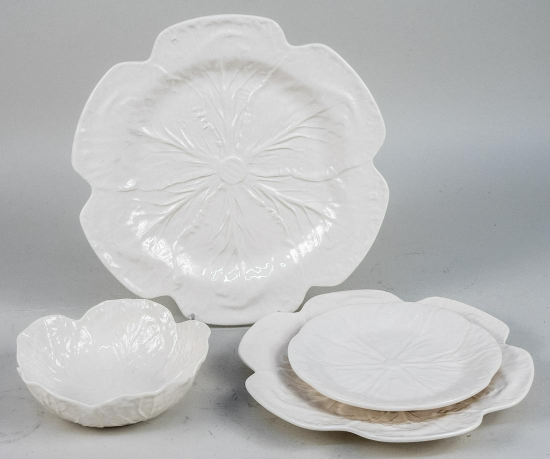 Bordalllo Pinheiro Cabbage White Dinner Service: Fifty pieces, comprising eight chargers, eighteen dinner plates, eight bread plates, and sixteen cereal bowls. Dinner plate diameter 10 1/2 inches. Notice to bidders: Due to the nature of this particu