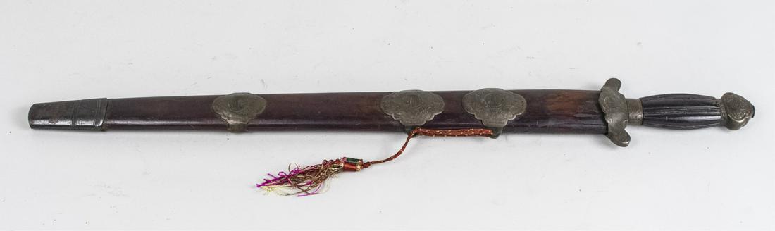 Korean Geom (Sword): The single edged straight blade with etched bronze guard and pommel and reeded tapered wood grip, the accompanying wood scabbard with matching bronze mounts. Blade length 17 7/8 inches, overall length