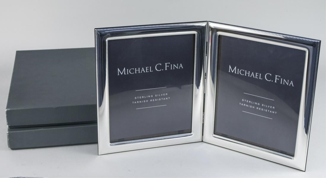 Pair of Michael C Fina Silver Picture Frames: Lexington pattern double 8 x 10 frames. Notice to bidders: Due to the nature of this particular online sale, the lots offered may not be available for detailed condition reports or additional photogra