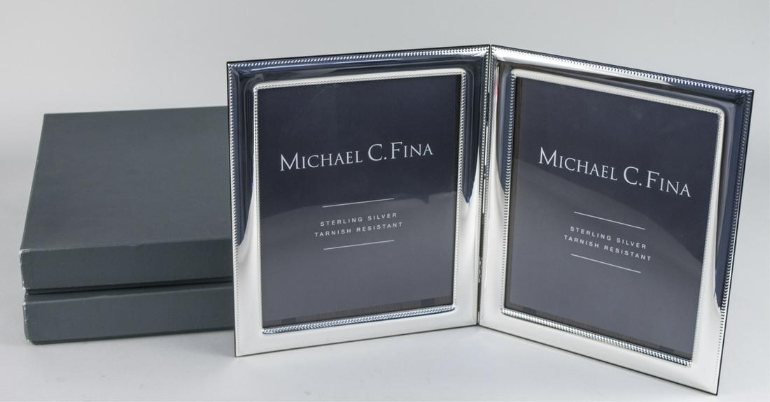 Pair of Michael C Fina Silver Picture Frames: Lexington pattern double 8 x 10 frames. Notice to bidders: Due to the nature of this particular online sale, the lots offered may not be available for detailed condition reports or additional photogra