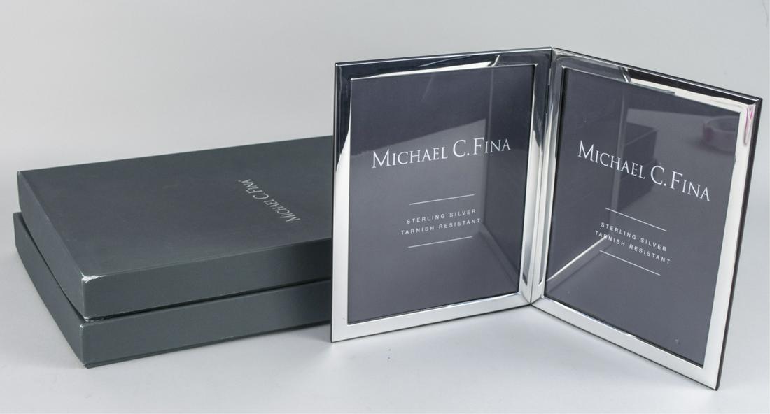 Pair of Michael C Fina Silver Picture Frames: Manhattan pattern double 8 x 10 frames. Notice to bidders: Due to the nature of this particular online sale, the lots offered may not be available for detailed condition reports or additional photogra