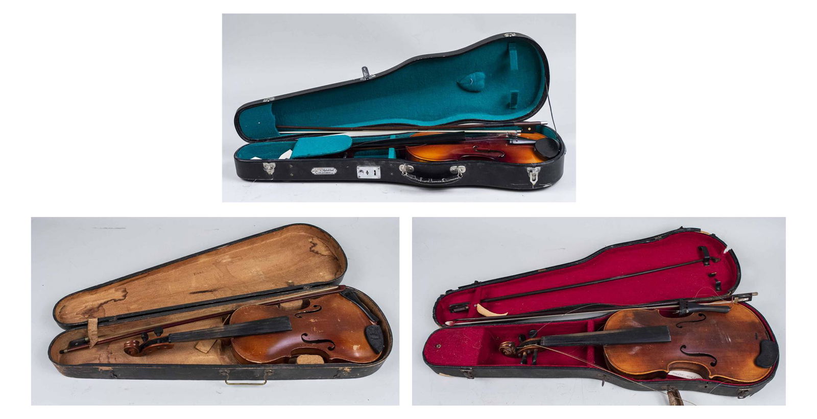 Three Violins: With storage cases. Length 14 3/4 inches. Notice to bidders: Due to the nature of this particular online sale, the lots offered may not be available for detailed condition reports or additional photog