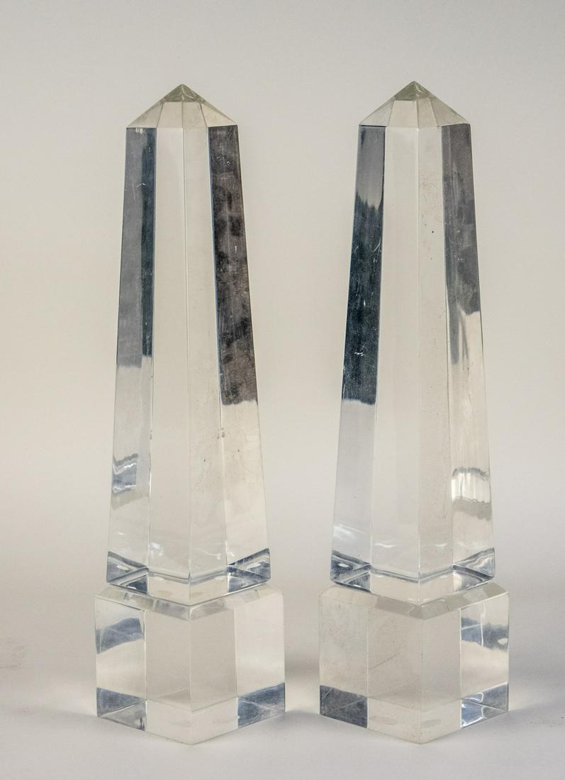 Pair of Lucite Obelisks: Height 19 inches. Notice to bidders: Due to the nature of this particular online sale, the lots offered may not be available for detailed condition reports or additional photography. The absence of a