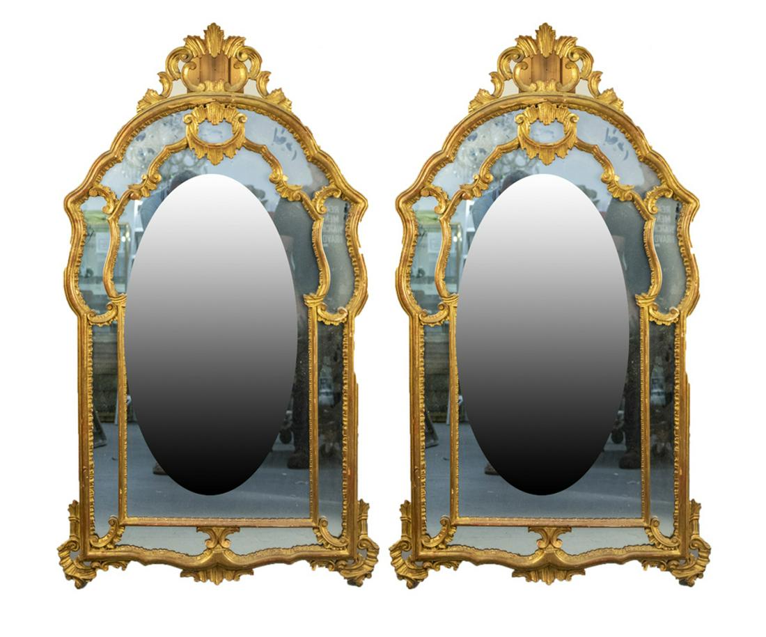 Pair of Gilt Wood Mirrors: Rococo style with arched tops. Height 54 inches, width 30 inches. Notice to bidders: Due to the nature of this particular online sale, the lots offered may not be available for detailed condition repo