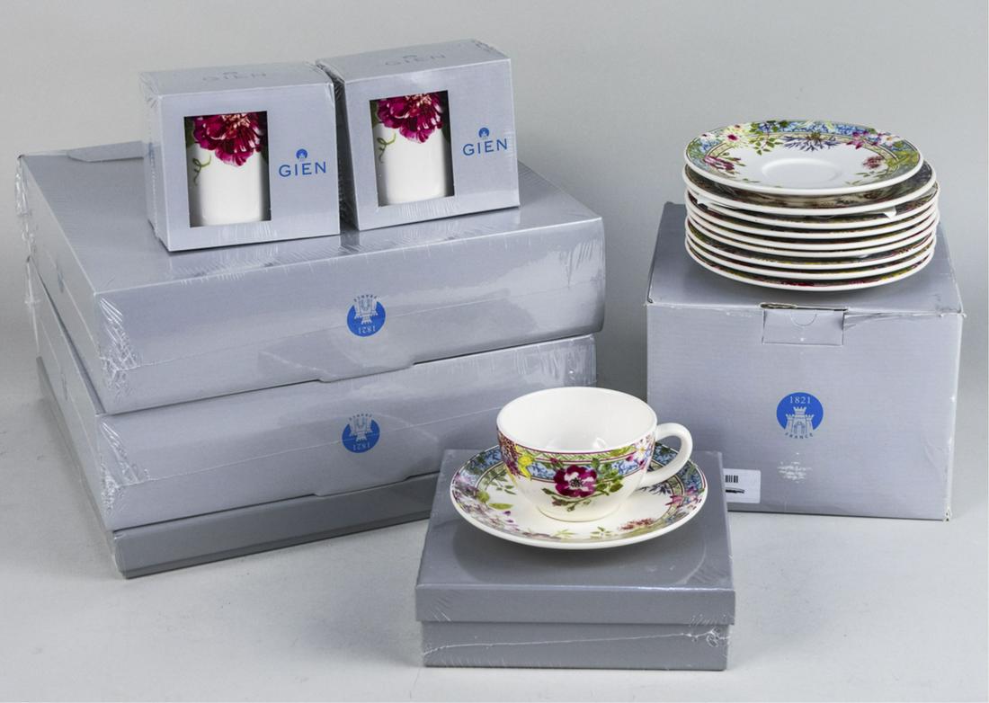 Gien Millefleurs Partial Dessert Service: Twenty eight pieces, comprising a set of eight dinner plates, a cake platter, twelve canape plates, two teapots, a cup and two saucers and two mugs. Canape plate diameter 6 1/2 inches. Notice to bidde