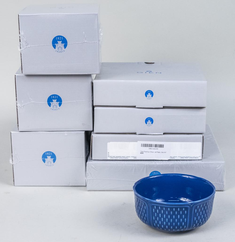 Gien Pont aux Choux Bleu Partial Dessert Service: Thirty four pieces, comprising sixteen dessert plates, three mugs, twelve canape plates and three cereal bowls. Notice to bidders: Due to the nature of this particular online sale, the lots offered ma