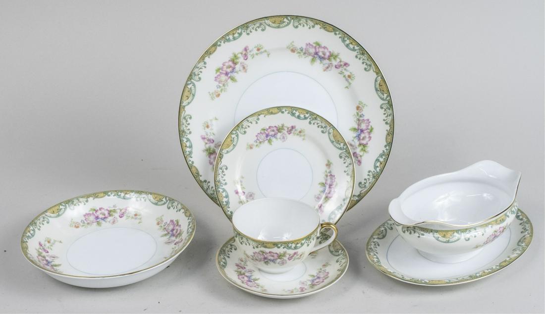 Japanese Porcelain Dinner Service: Comprising twelve dinner plates, twelve salad plates, ten bowls, twelve bread plates, twelve dessert bowls, twelve cups, ten saucers, and serving dishes. Dinner plate, diameter 10 inches. Notice to bi