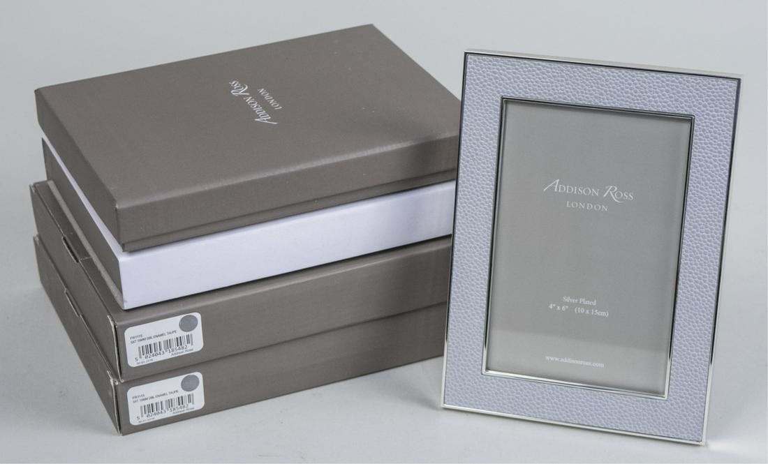 Group of Four Addison Ross Picture Frames: Including two taupe enamel 5 x 7 frames and two lilac shagreen 4 x 6 frames, in original boxes. Notice to bidders: Due to the nature of this particular online sale, the lots offered may not be availab
